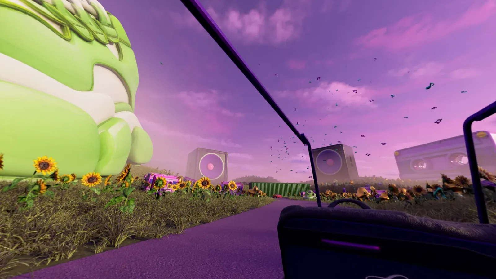 A passenger’s view from the golf cart, looking toward a giant green sneaker, sunflowers and speakers in Tyler’s world.